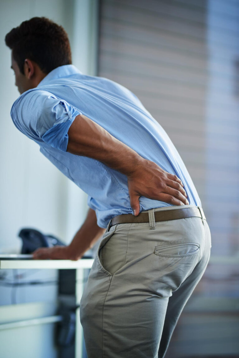 man with back pain in need of disc therapy mckinney tx